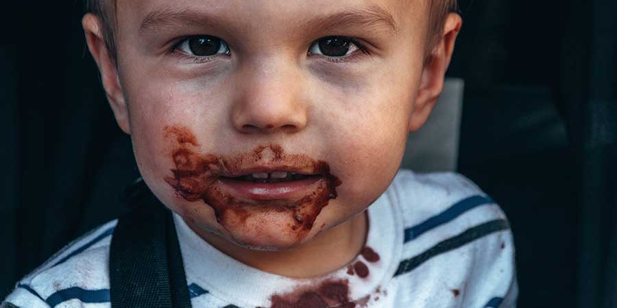 kid, eating dark chocolate in pakistan